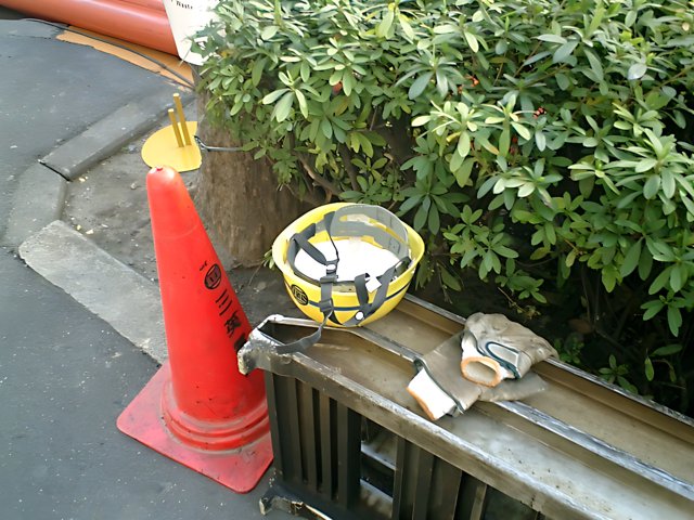Yellow Hardhat on City Ledge