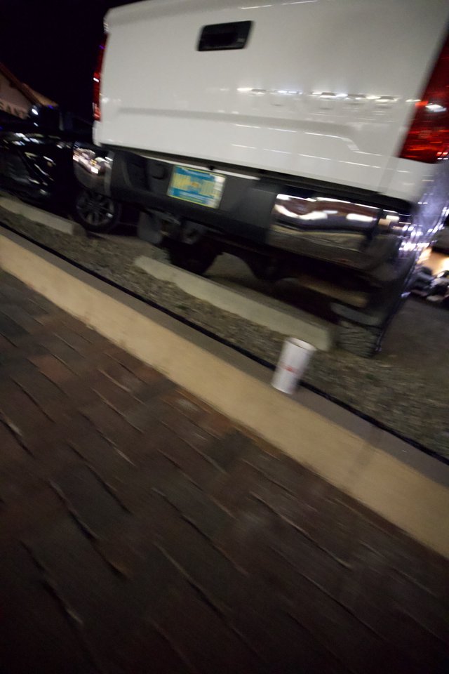 White Van Parked on Santa Fe Boardwalk at Night