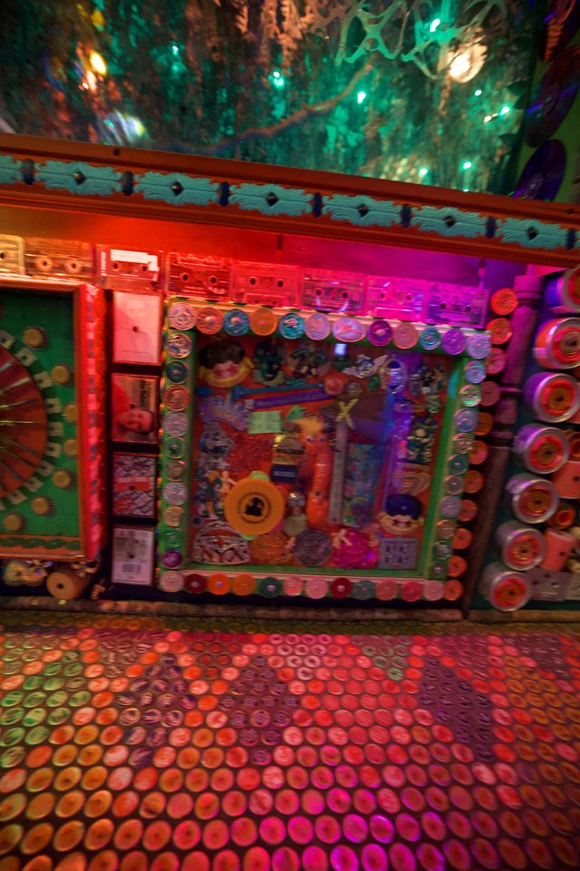 Vibrant Folk Art Installation with Illuminated Decorative Walls