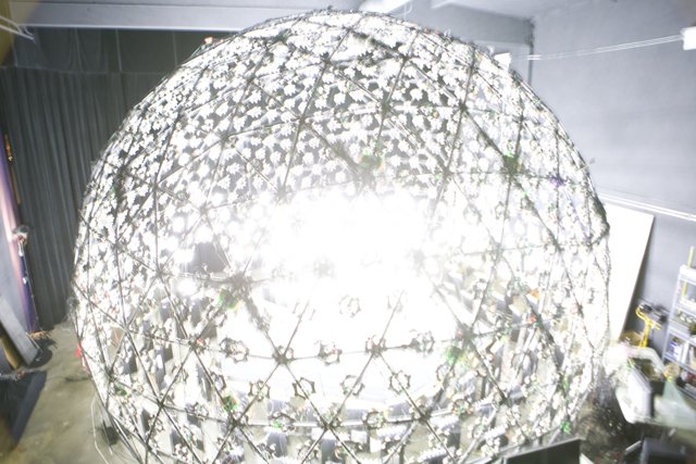 Illuminated Sphere in Architectural Wonder Caption: A stunning lamp-like sphere hung like a chandelier in an intricately designed building during the 2008 USC tour. The combination of lighting and structure created a mesmerizing experience. #Sphere #Lamp #Dome #Building #Architecture #Chandelier #Lighting