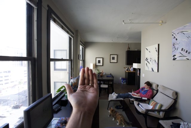 Hand in front of Living Room Window