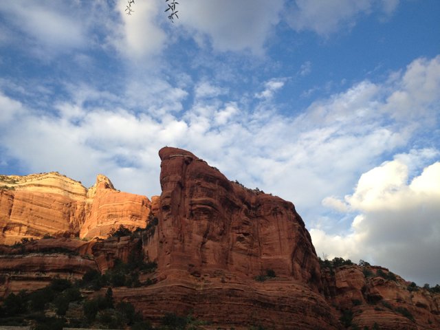 Majestic Red Rock Formation and Cloudy Skies