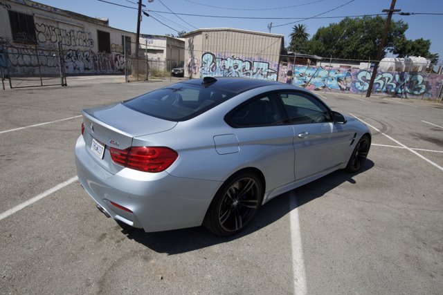 BMW M4 Coupe Shines in a Colorful Parking Lot