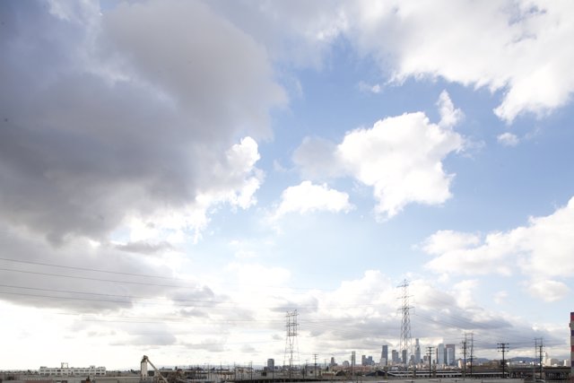 Cumulus Clouds over Industrial Landscape
