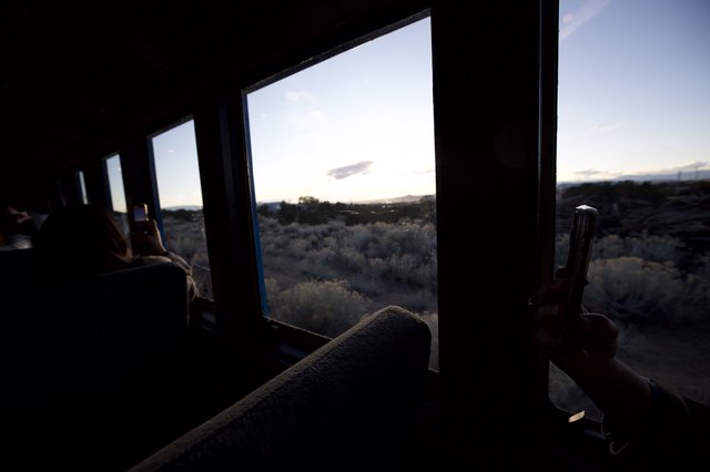 Desert Sunset View Through Train Window at Dusk