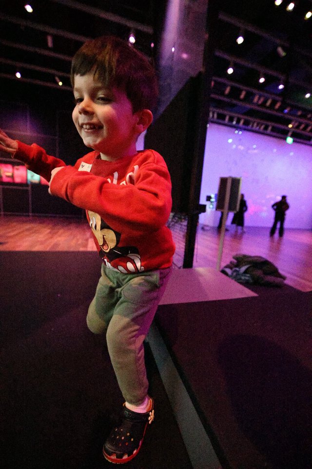 Young Boy Dancing Joyfully at Baby Rave Event