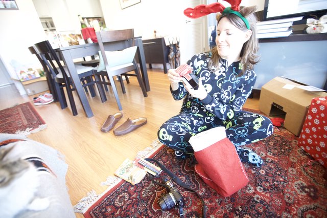 Joyful Christmas Morning Gift Opening in Skull Pajamas