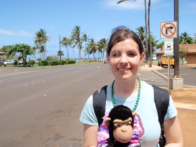 Smiling Woman with Monkey Plush in Hawaiian Parking Lot
