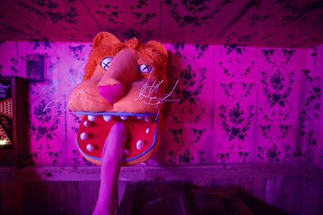 Surreal Plush Lion in Neon-Lit Decaying Interior