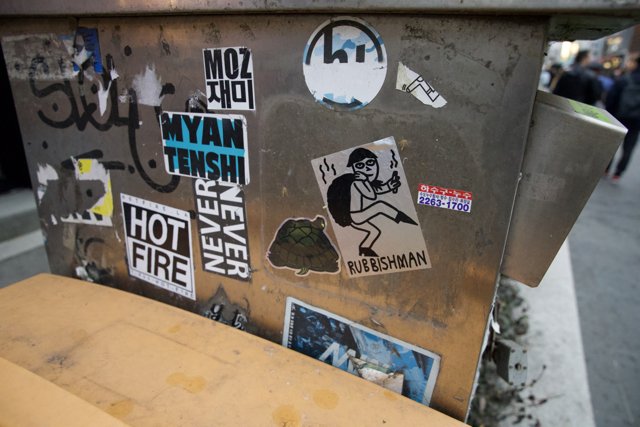 Urban Aspect: The Sticker Laden Trash Can