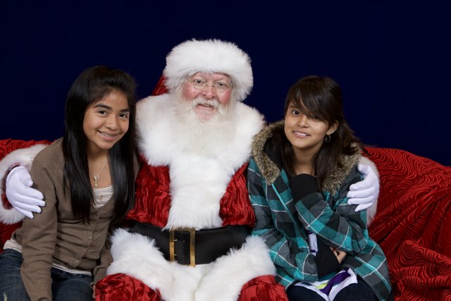 Santa Claus and Two Girls at the APC Xmas Party