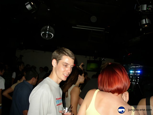 Red-Headed Club-goer in Front of a Crowd
