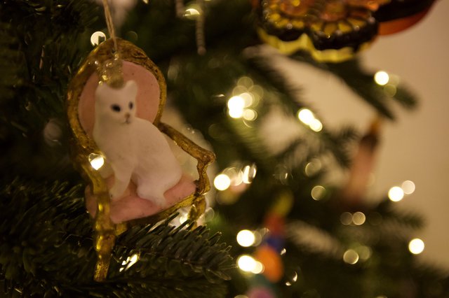 White Cat Christmas Ornament on Illuminated Tree