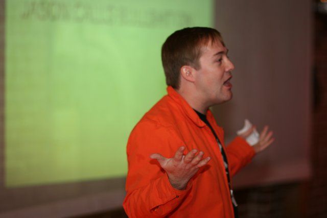 Man in Orange Shirt in Barcamp 3
