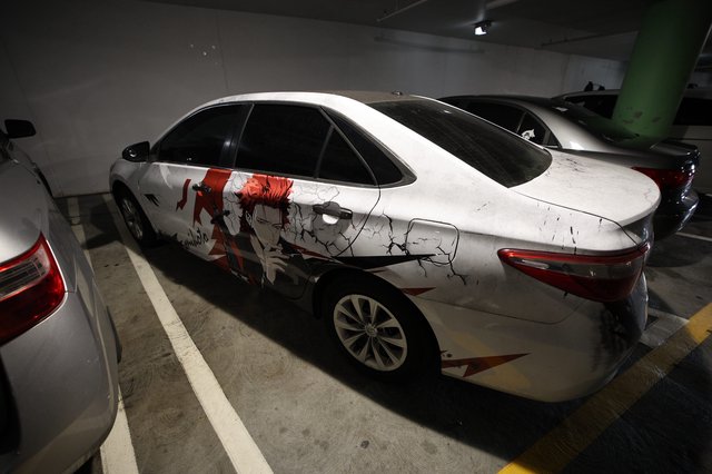 Anime-Wrapped Sports Car in Underground Parking Garage