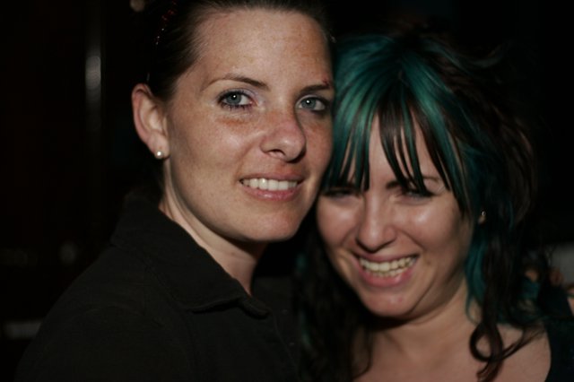 Two Friends Share a Joyful Moment at Night