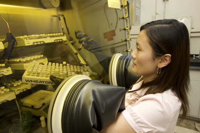 Woman in Lab Analyzing Machine
