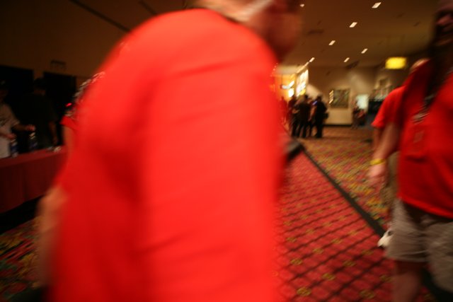 Blurred Man in Red Shirt