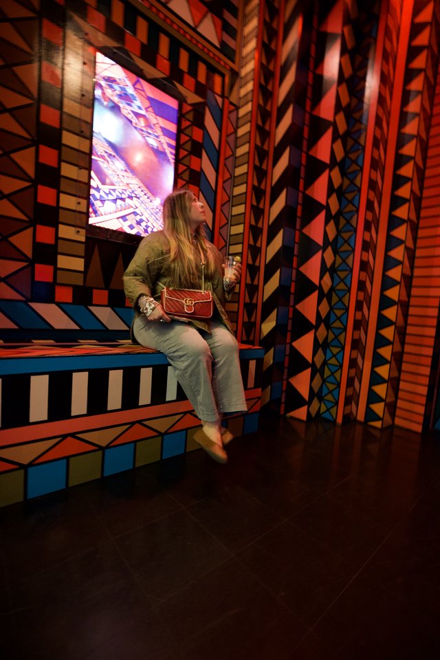 Woman in Colorful Geometric Art Installation