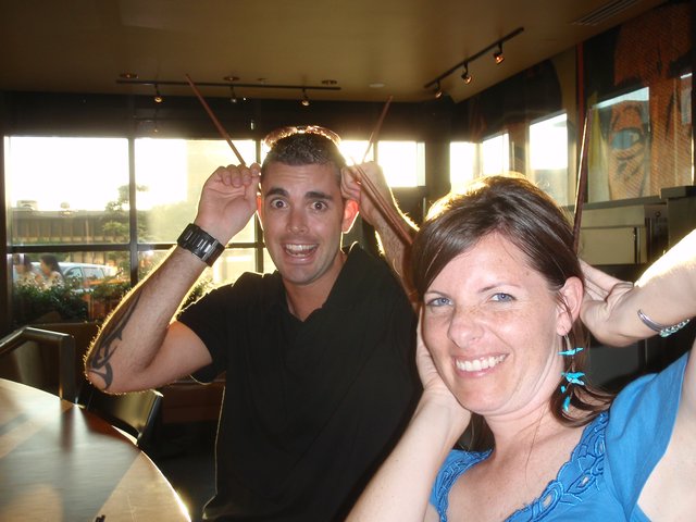 Friends Making Silly Faces at Restaurant Table