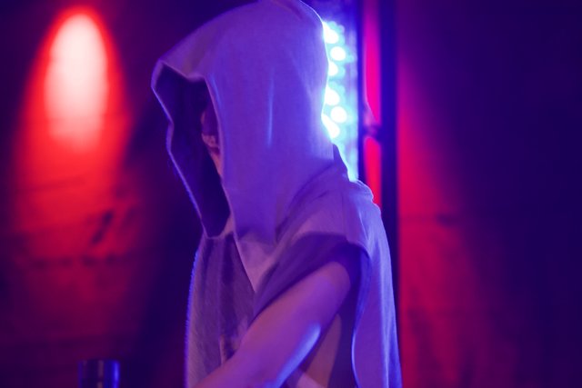 Spotlight on the Hooded Performer