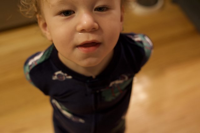 Toddler's Curious Expression on Christmas Morning
