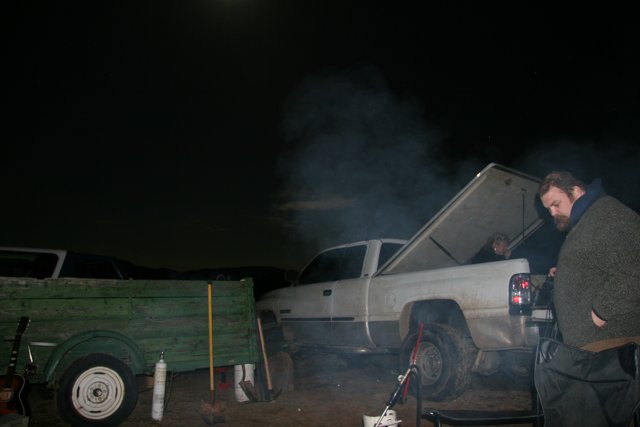Man and Truck Under the Night Sky