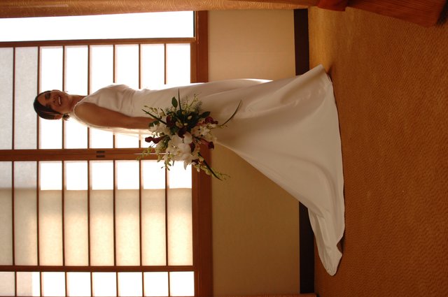 Radiant Bride Poses in Elegant Wedding Gown
