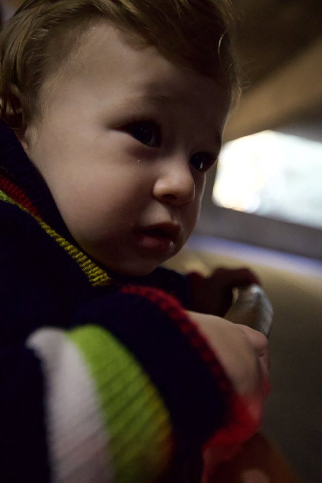 Young Child in Colorful Striped Shirt Close-Up