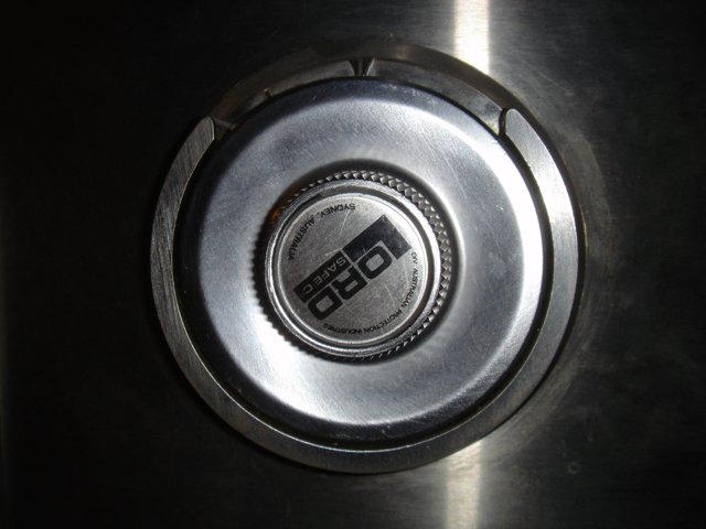 Metal Button Logo on Stove