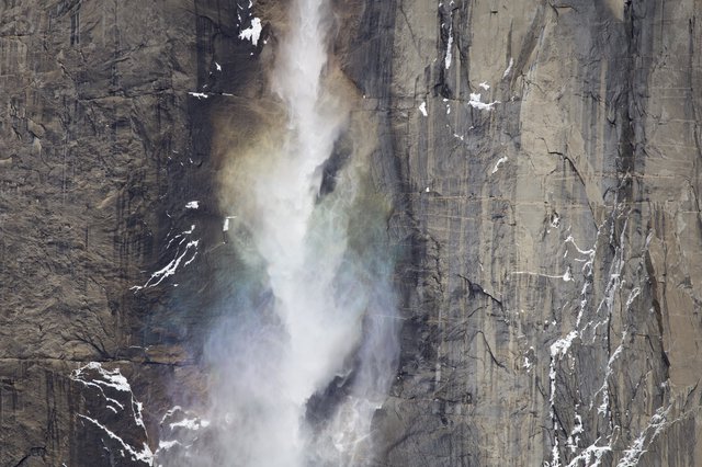 Yosemite Waterfall Mist Against Granite Cliff Face