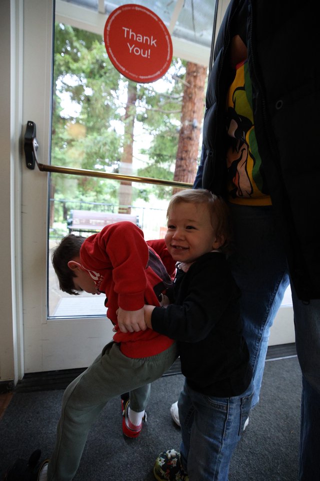 Young Children Pushing Door Together at Skywalker Ranch
