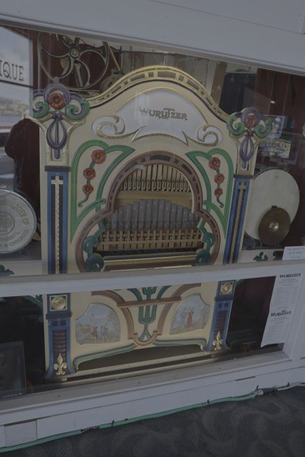 Grand Antique Organ Displayed in Glass Case