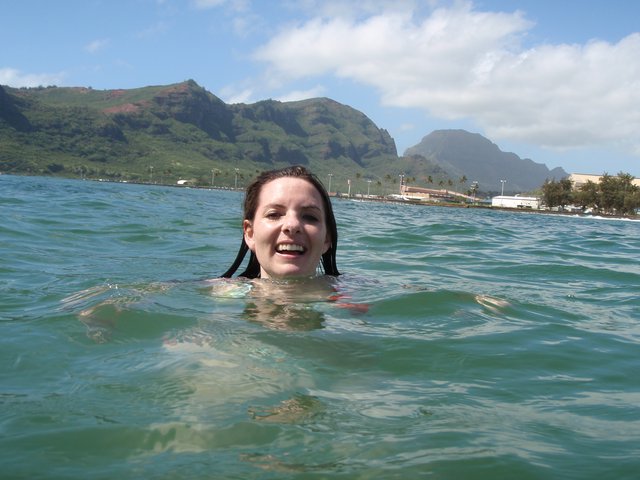 Joyful Ocean Swim with Hawaiian Mountain Backdrop