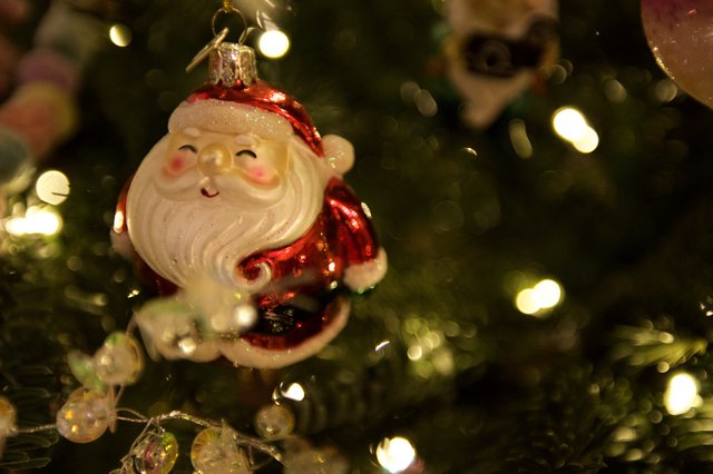Cheerful Santa Claus Christmas Tree Ornament with Bokeh Lights