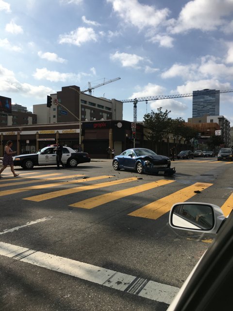Police Car at a Crosswalk in Busy LA