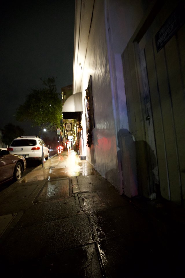 Wet Urban Sidewalk on a Misty Night
