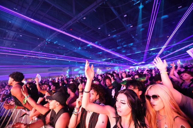 Electric Crowd Erupts Under Laser Light Show