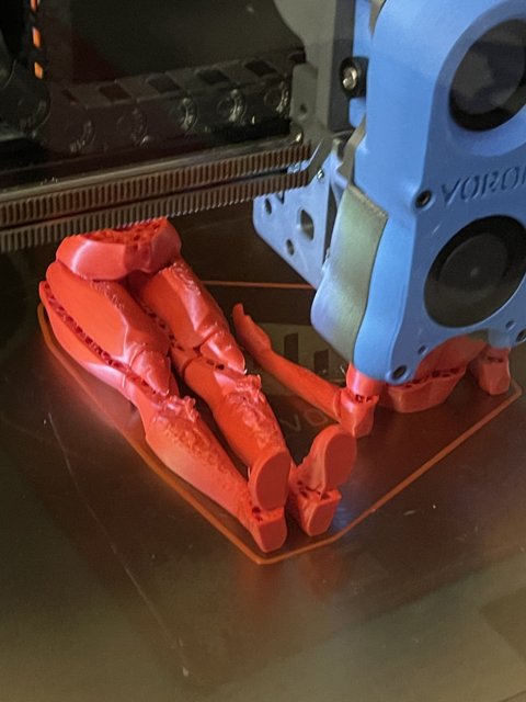 3D Printed Robot with a Red Arm