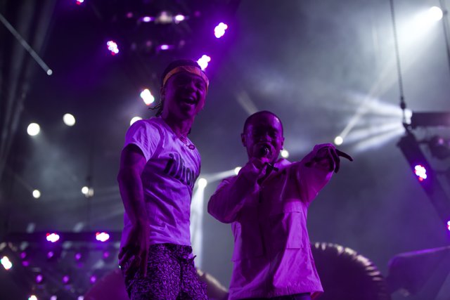 Two Men Illuminate the Crowd with Purple Lights at Coachella 2017