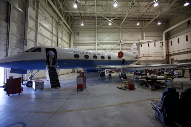 Blue and White Aircraft in Hangar