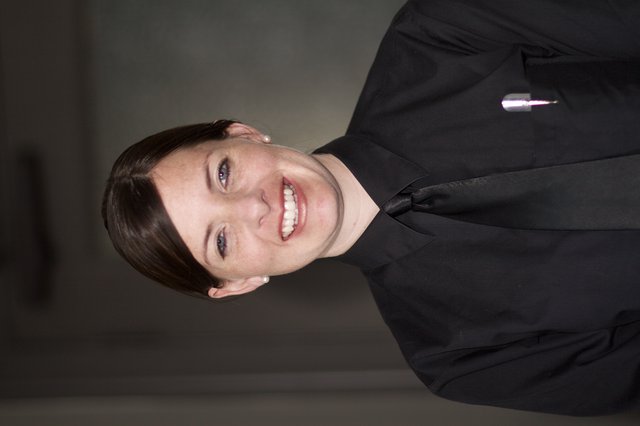 Smiling Service Professional in Black Uniform Portrait