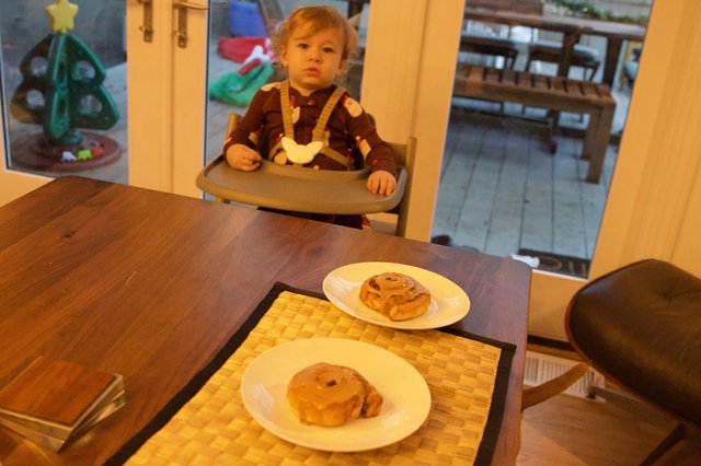 Toddler Awaiting Christmas Breakfast at the Table