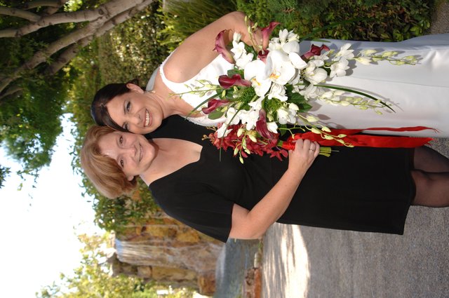 Bride and Friend Embrace Before Wedding Ceremony