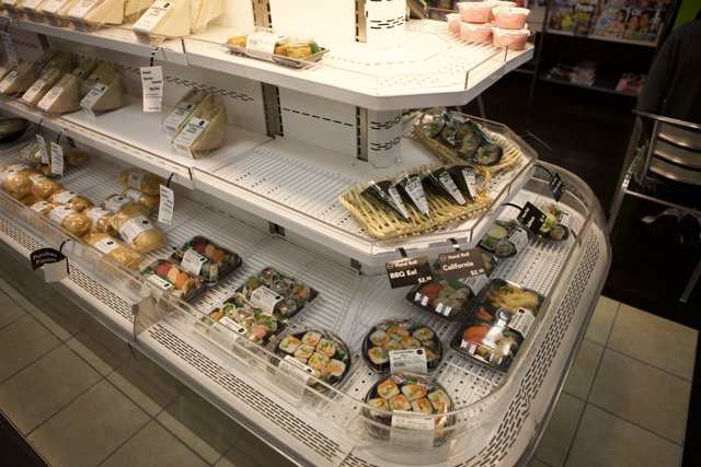 A Deli Display Case Filled with Sushi and More