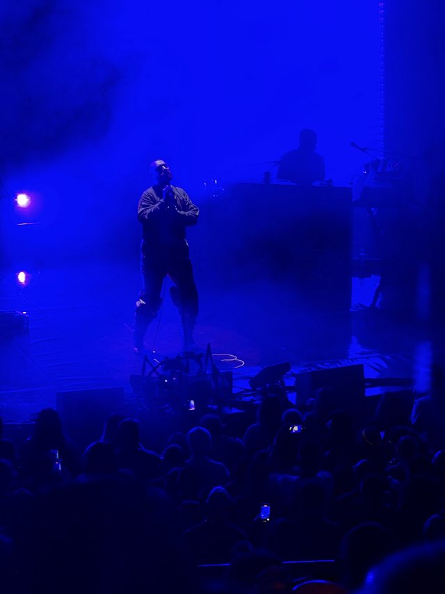 Concert Performer in Dramatic Blue Stage Lighting