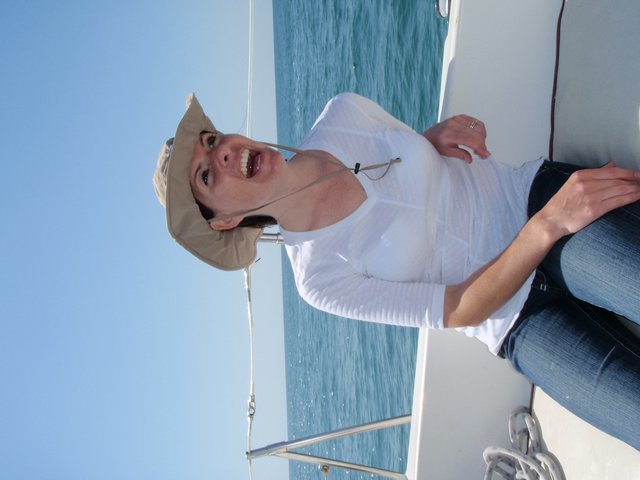 Joyful Woman Sailing on Open Waters