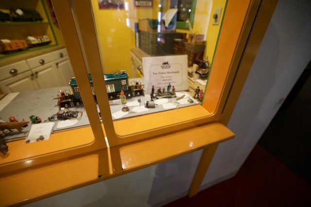 Vintage Toy Train Mechanic Miniature Display Behind Glass
