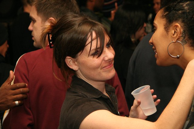 Candid Party Conversation Between Two Women