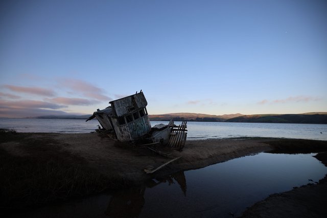 Abandoned Shipwreck at Twilight on California Coast